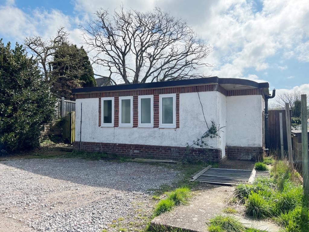 Lot: 8 - FORMER PUBLIC TOILETS WITH PLANNING FOR CONVERSION - Front photo of former public toilets in Wroxall Isle of Wight